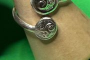 Hand made silver Celtic triskele adjustable ring. Size O plus or minus one size