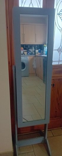 Grey freestanding jewellery cabinet with mirror