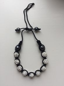 White & black beaded bracelet with diamonds