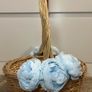 Wicker basket with artificial blue flowers. Image 2
