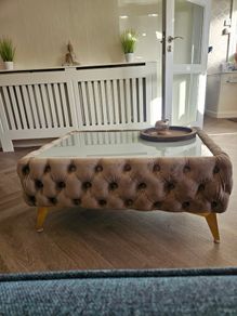 Velvet button-tufted coffee table with glass top