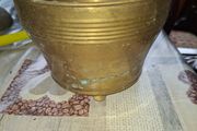 Antique Footed Brass Cachepot Planter features horizontal ribbing near the flared rim and subtle aged patina,