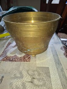 Antique Footed Brass Cachepot Planter features horizontal ribbing near the flared rim and subtle aged patina,