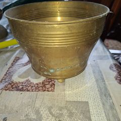 Antique Footed Brass Cachepot Planter features horizontal ribbing near the flared rim and subtle aged patina,