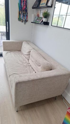 Three-seater beige fabric sofa