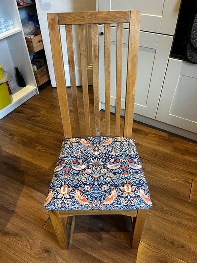 Solid oak dining table & 6 reupholstered dining chairs