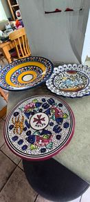 3 hanging wall plates -1- from Malta hand painted -2- from PORTGAL HAND PAINTED-3- FROM MAROCO - EACH IS 22.00 Euro.