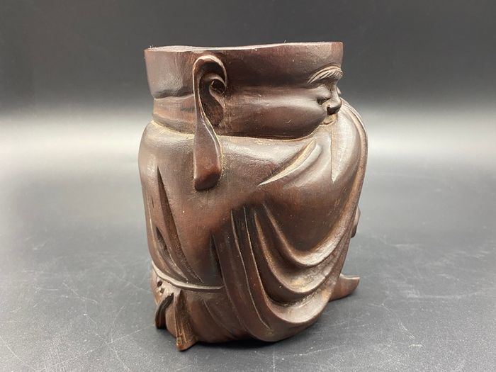 Chinese carved hardwood brush pot, carved with a Chinese Man