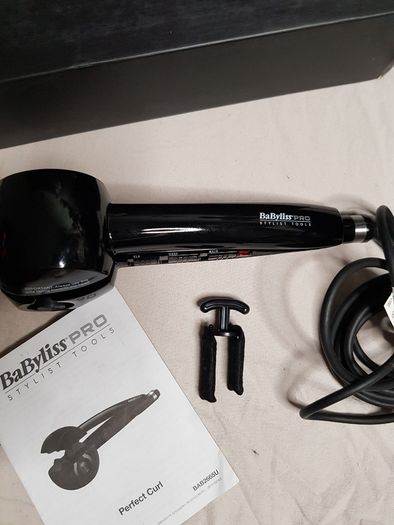BaByliss PRO Perfect Curl styling tool, highlighting its "Auto Curl technology for creating effortless curls.
