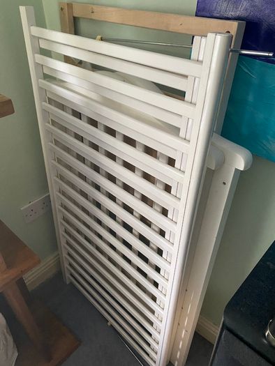 White wooden cot