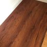 Beautiful Laminate Wood Flooring in dark wood taken up from a room measuring approximately 11 x 7 ft. Image 2