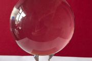 Crystal glass ball on wood/metal base.