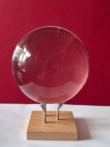 Crystal glass ball on wood/metal base.