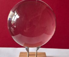 Crystal glass ball on wood/metal base.