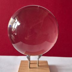 Crystal glass ball on wood/metal base.
