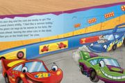 Jigsaws of racing cars in a book