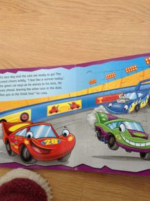 Jigsaws of racing cars in a book