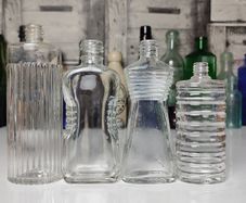 308 - Set of 4 Vintage Decorative Ribbed Collectible Clear Glass Bottles
