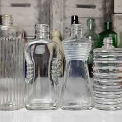 308 - Set of 4 Vintage Decorative Ribbed Collectible Clear Glass Bottles