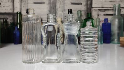 308 - Set of 4 Vintage Decorative Ribbed Collectible Clear Glass Bottles