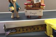 Small ornamental bear and honey stand
