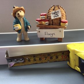 Small ornamental bear and honey stand