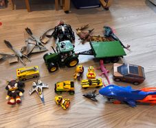 Mixture of toys godzilla, venom, dinosaurus, tracyor