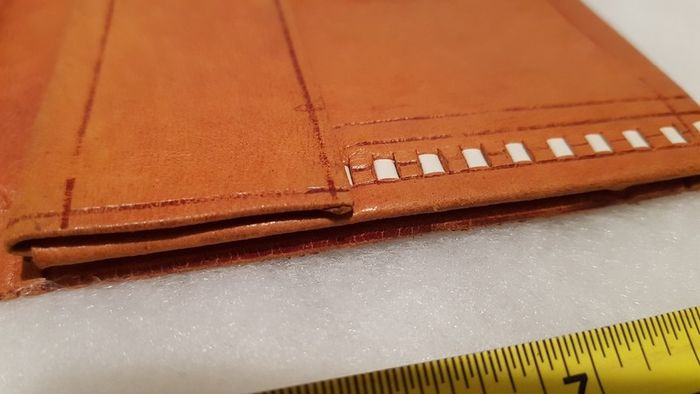 handcrafted made soft leather wallet,with designs ,, thank you,,was used,some wear and tear,,take as is ..