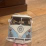 vintage Volkswagen caravan Elle with surfboard on top Image 2