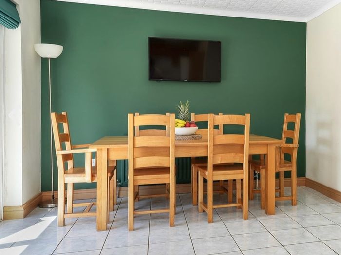 Solid Wooden Dining Table and Matching Chairs