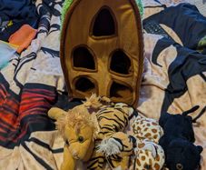 Plush animal carrier with four soft toy animals