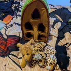 Plush animal carrier with four soft toy animals