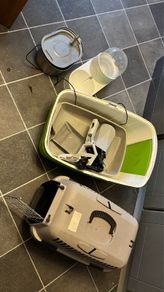 cat cage, litter box, liter scoop, drinking fountain