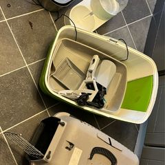 cat cage, litter box, liter scoop, drinking fountain