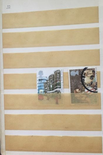 Small brown stamp stock book. 13cm x 18.5cm. 24 page / 12 leaf. Album contains used England Stamps with values over 29p