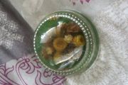 nice paper weight with flowers inside glass .
