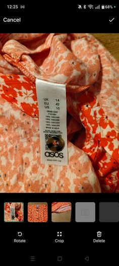 Asos Printed Crepe Midi Skirt features an orange ditsy floral print and a button down front. New with Tags
