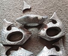 five cast metal napkin ring's