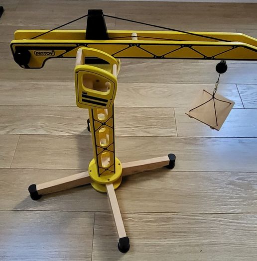 yellow wooden tower crane