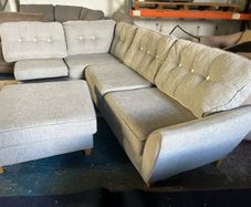 Grey corner sofa with matching footstool