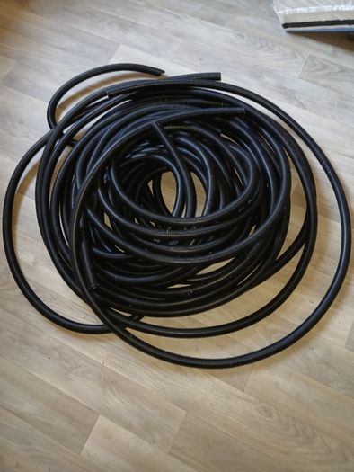 Black corrugated closed conduit.