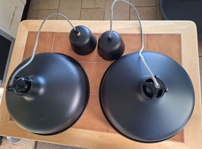 Two large industrial style pendant ceiling lights