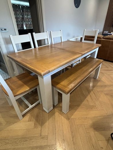 Large extendable 8 seater table with 5 chairs and a bench