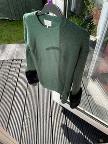 Green jumper with black fur cuffs