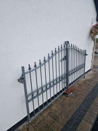 Decorative galvanised double steel gates.