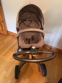 Stokke pram and buggy with rain cover and storage bag
