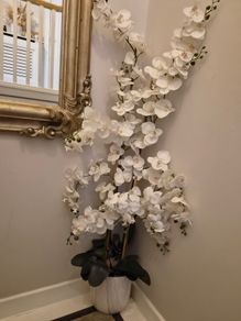 Large faux orchid in marble look pot