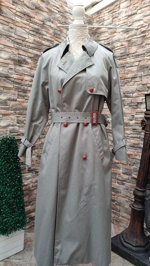 Vintage Nuage ladies trenchcoat Approximately late 90s early 00s Size 10 on label The colour is a pale bluey grey with brown buttons It's got an inner lining that can be removed