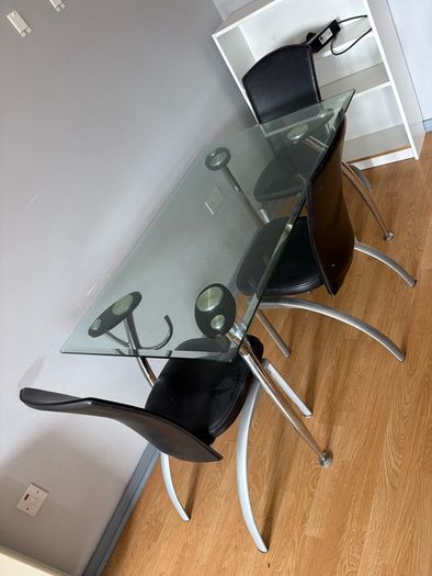glass dining table with 3 leather chairs