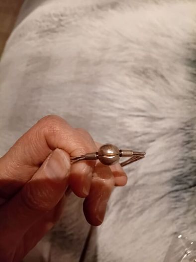 Silver tone bracelet with ball clasp